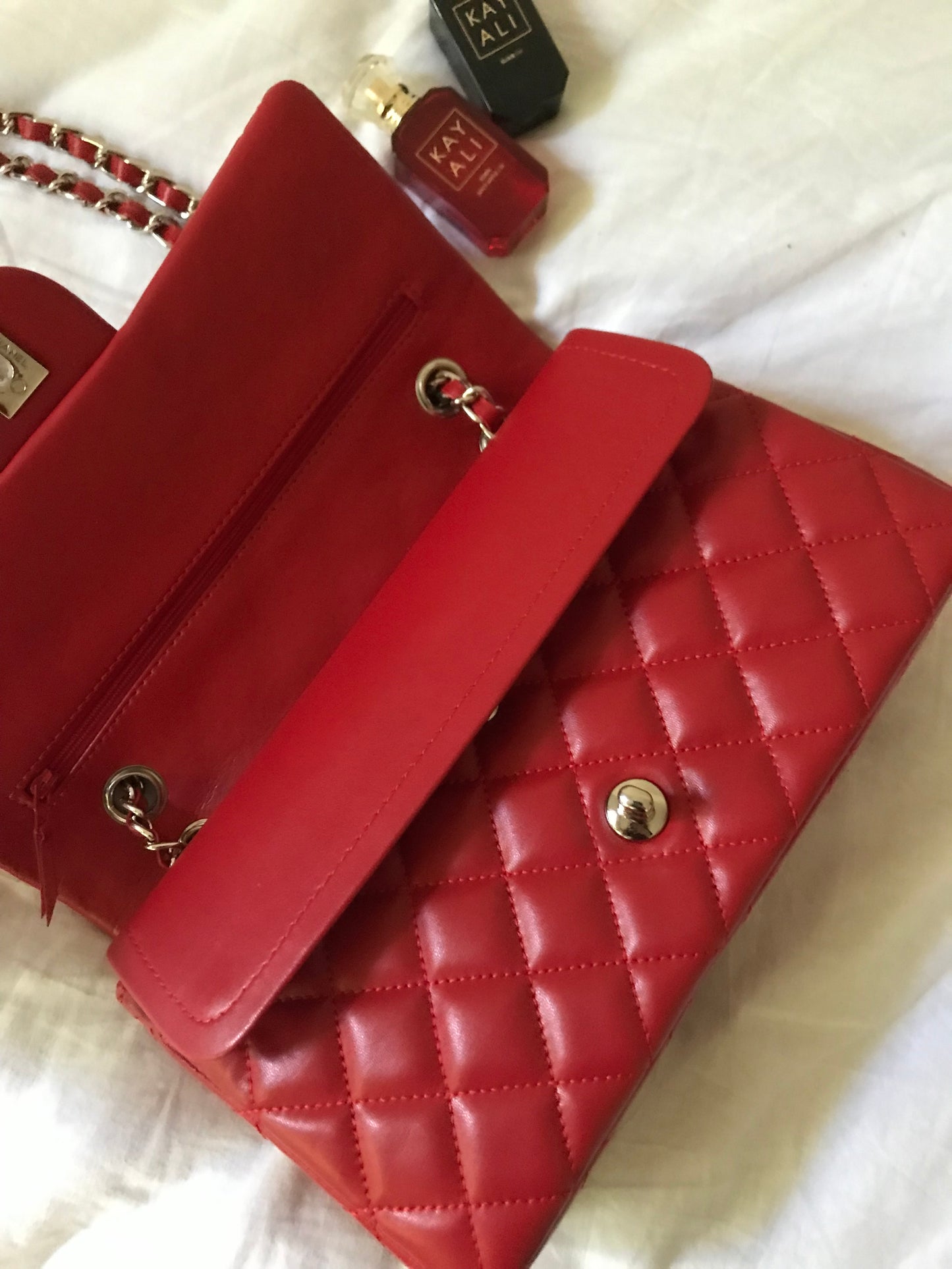 Red quilted cross body bag