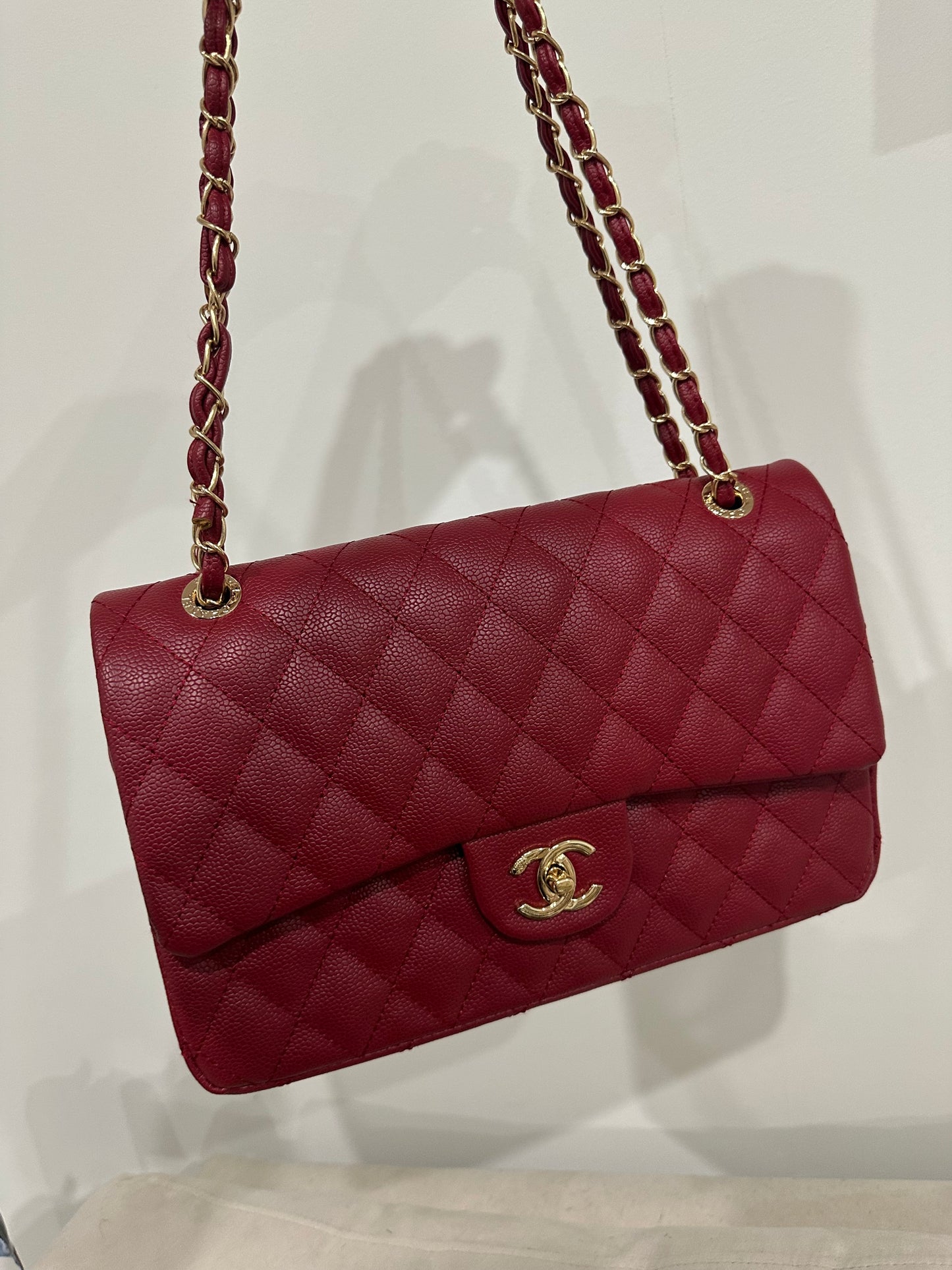 Red quilted cross body bag