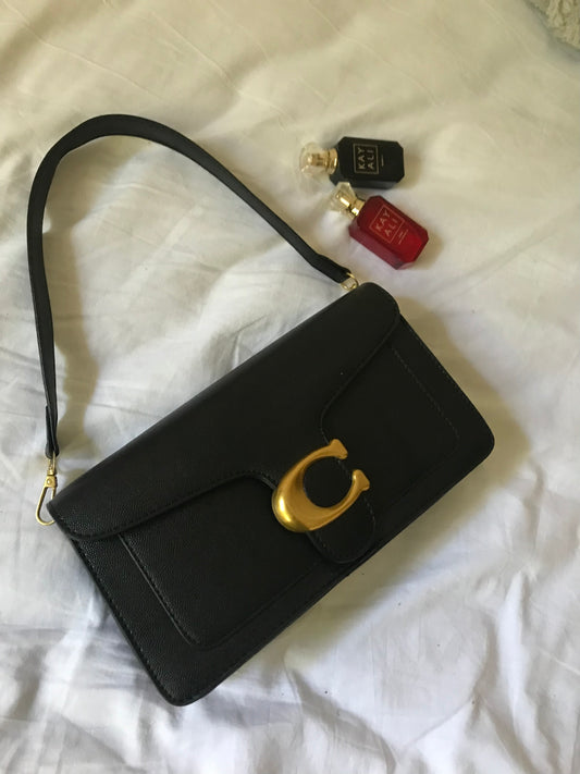 Black hand bag with cross body strap