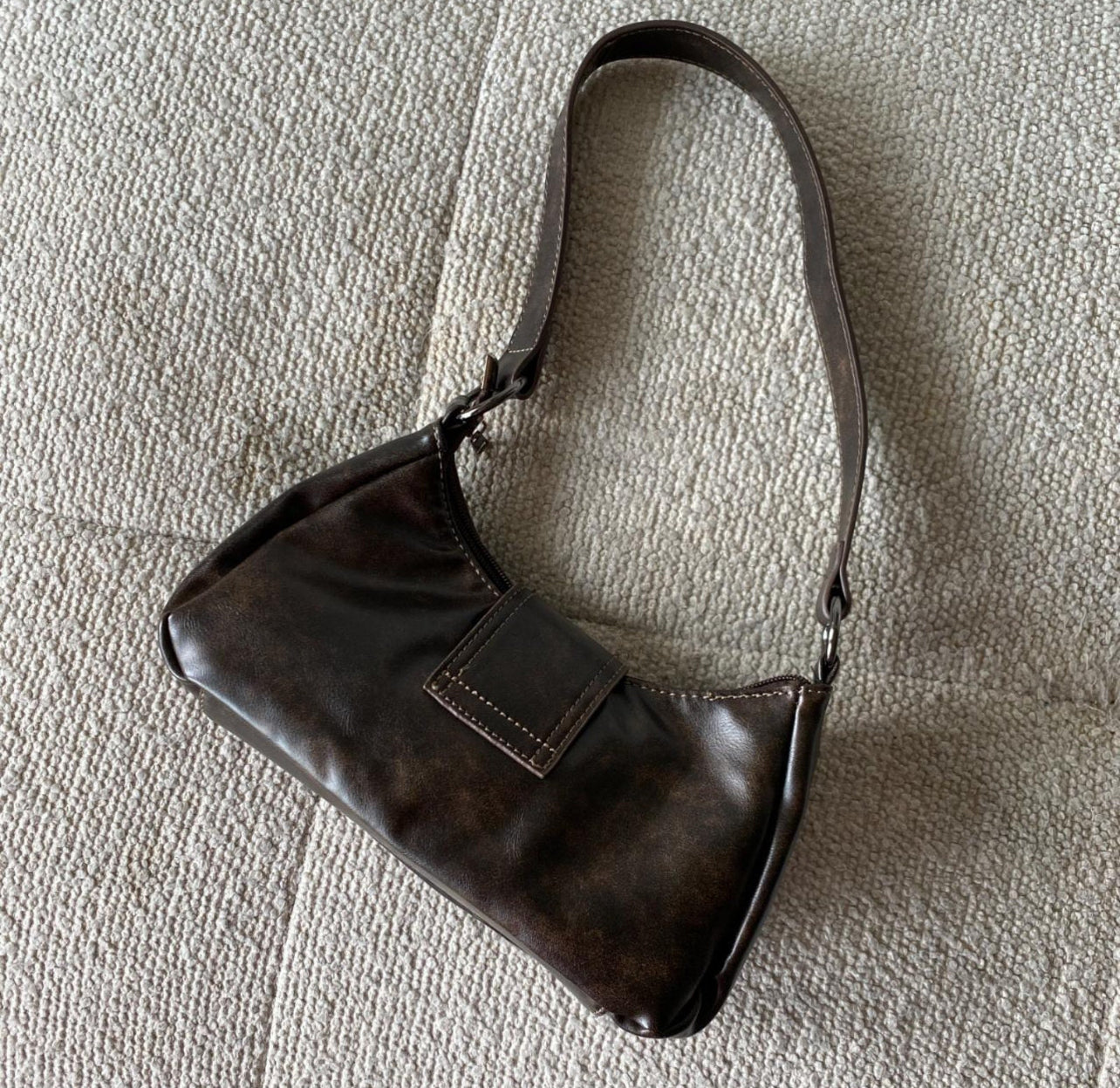 Brown leather buckle bag