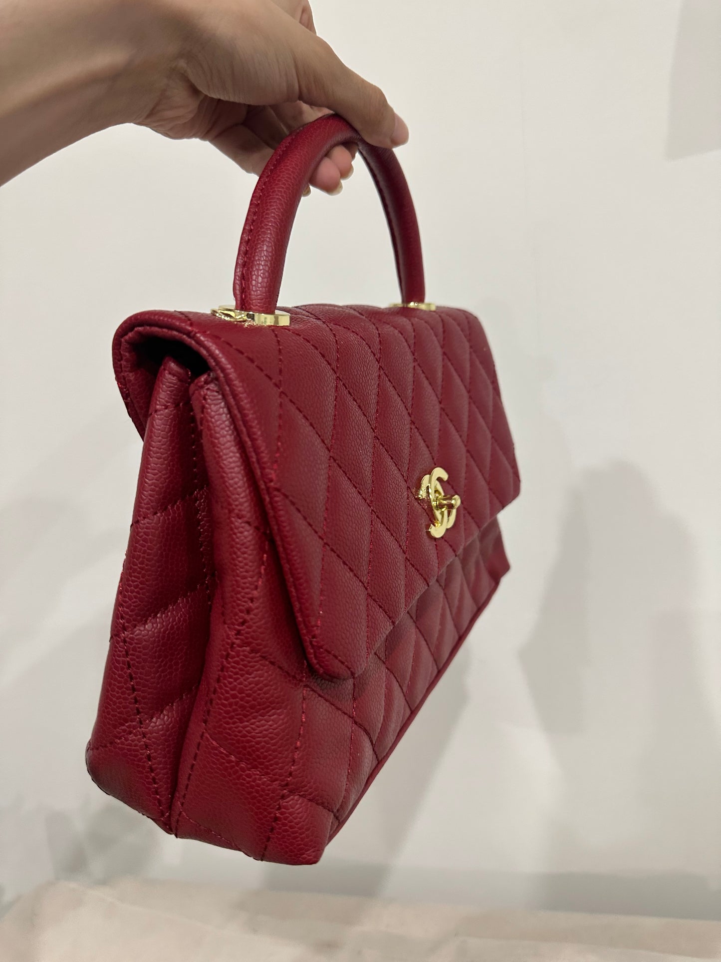 Red quilted cross body bag