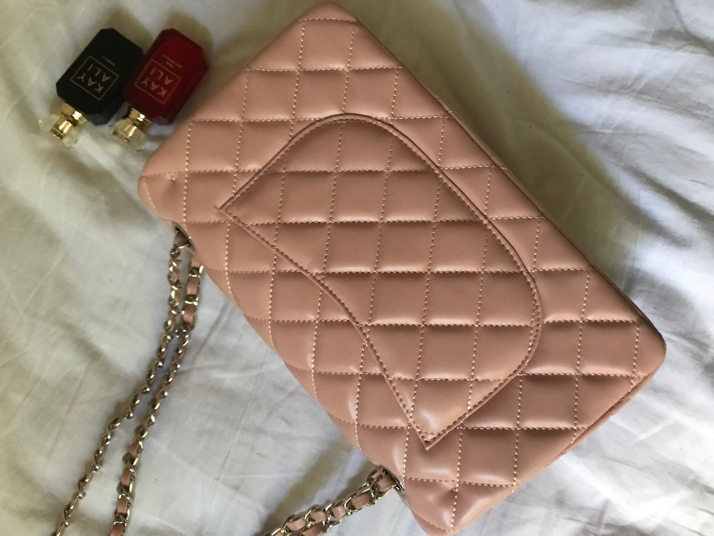 Pink quilted cross body bag