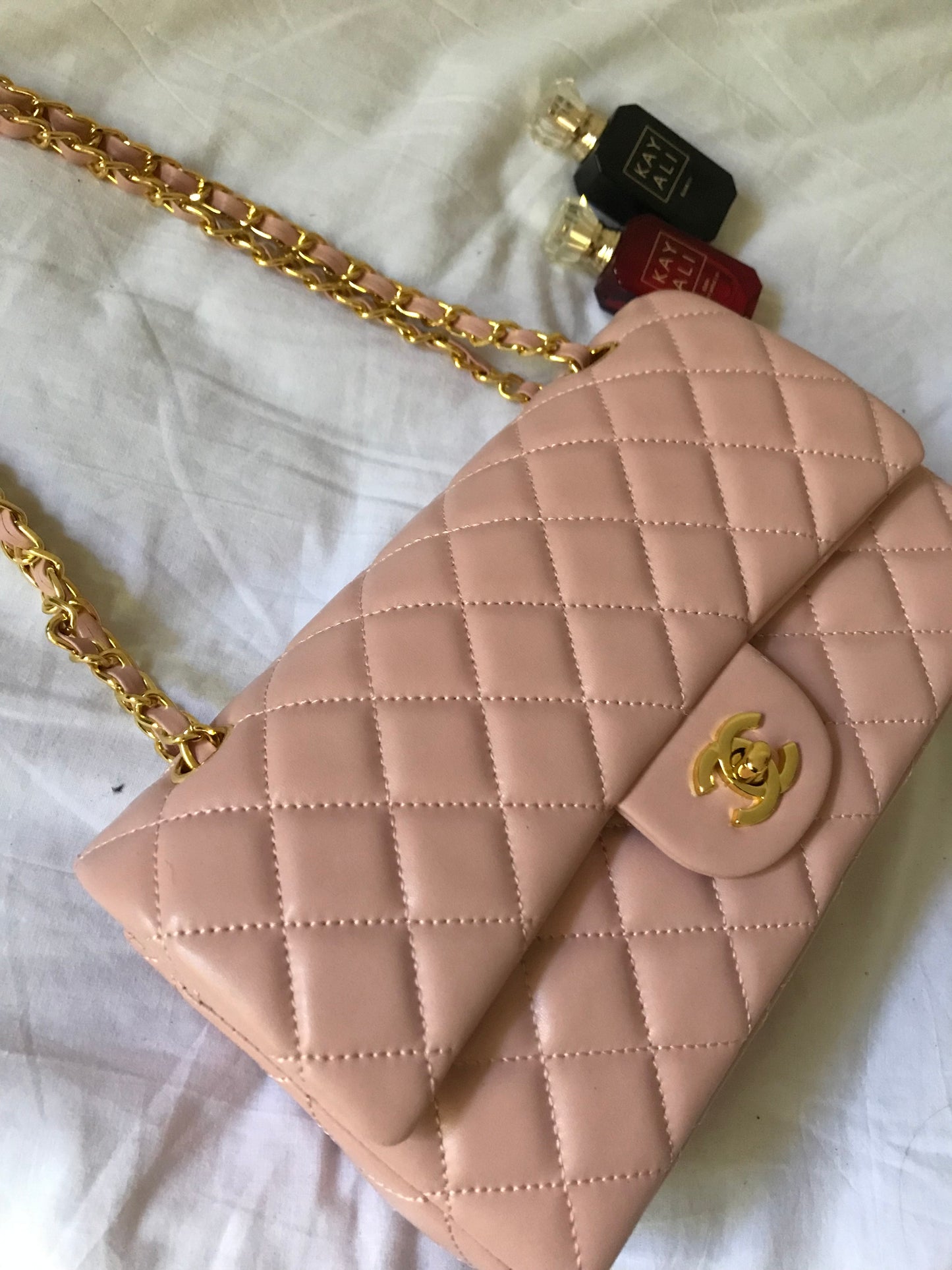 Pink quilted cross body bag