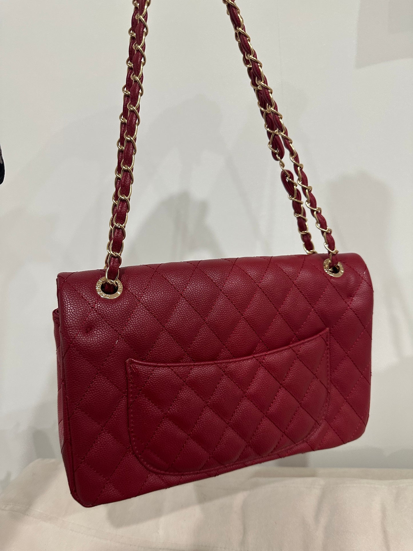 Red quilted cross body bag